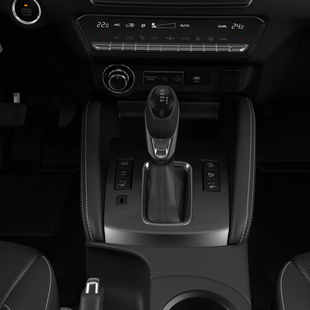 Consola central de la Mazda BT-50 2025 con palanca de cambios automática, controles inteligentes y climatización dual.